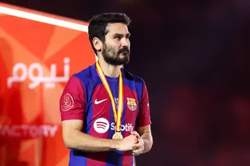 Ilkay Gundogan of FC Barcelona looks dejected with his runners-up medal after the team's defeat in the Super Copa de España Final match between Real Madrid and FC Barcelona in Riyadh