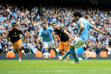 Hit and miss: Ilkay Gundogan fails to convert his penalty in Manchester City's 2-1 win over Leeds