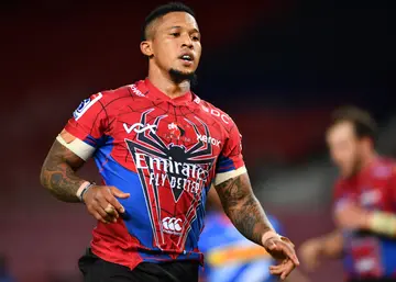 Elton Jantjies celebrates after scoring during the Super Rugby Unlocked match
