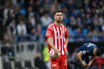 Union Berlin midfielder Milos Pantovic reacts after missing a penalty kick