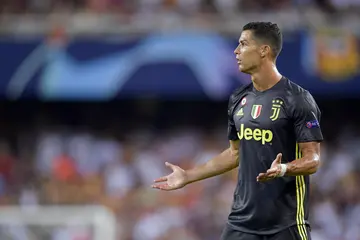 Cristiano Ronaldo reacts after getting a red card during the match between Valencia and Juventus 