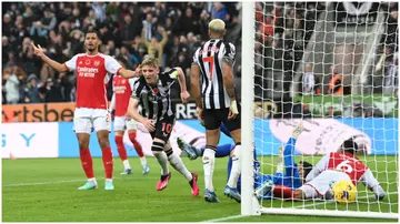 Anthony Gordon runs away to celebrate after scoring the winning goal during the Premier League match between Newcastle United and Arsenal FC at St. James Park. Photo by Stu Forster.