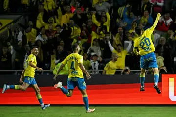 Las Palmas' Spanish midfielder Kirian Rodriguez celebrates scoring the opening goal against Atletico Madrid on Friday