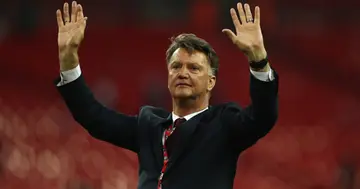 Louis van Gaal salutes the fans after winning The Emirates FA Cup at Wembley Stadium in 2016. Photo by Paul Gilham.
