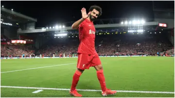 Mohamed Salah waves after being substituted during the UEFA Champions League match between Liverpool FC and AC Milan at Anfield. Photo by Simon Stacpoole.