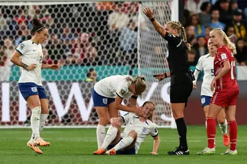 England's midfielder Keira Walsh reacts in pain