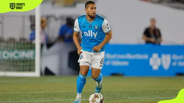 Bill Tuiloma dribbles the ball during a match