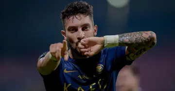 Alex Telles celebrates scoring for Al-Nassr.