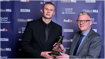 Erling Haaland with his FWA Footballer of the Year trophy alongside Chair of the FWA John Cross at the Landmark Hotel. Photo by John Walton.