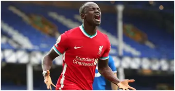 Sadio Mane of Liverpool celebrates after scoring his side's first goal during the Premier League match between Everton and Liverpool at Goodison Park. Photo by Peter Byrne.