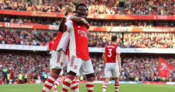 Bukayo Saka celebrates after scoring their side's third goal during the Premier League match between Arsenal and Tottenham Hotspur at Emirates. Photo by Clive Rose.