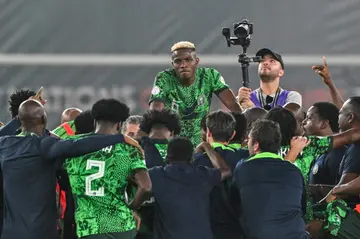 Victor Osimhen (C) and teammates celebrate after Nigeria reached the Africa Cup of Nations final.