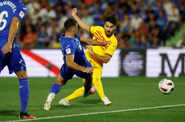 Ilkay Gundogan made his Barcelona debut as the Catalans slugged it out with an aggressive Getafe side
