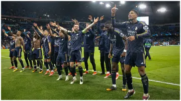 Real Madrid players celebrate winning the penalty shoot out and qualifying for the semi final after beating Manchester City