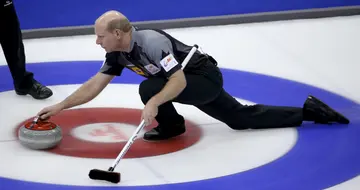 Skip Kevin Martin throws a rock in the Men's Semifinal against Team Morris at the Roar of the Rings Canadian Olympic Curling Trials at MTS Centre on December 7, 2013 in Winnipeg, Manitoba, Canada. (Photo by Trevor Hagan/Getty Images)