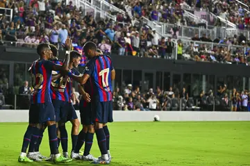 FC Barcelona’s (L), Alejandro Balde (C) and Pierre-Emerick Aubameyang (R) celebrate Ansu Fati's goal in a 6-0 victory over Inter Miami in a friendly football match