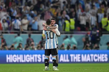 Argentina midfielder Rodrigo De Paul celebrates with Lionel Messi after a 2-1 win over Australia in the last 16
