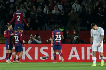 Barcelona's Portuguese defender Joao Cancelo celebrates scoring his team's second goal as they beat Napoli