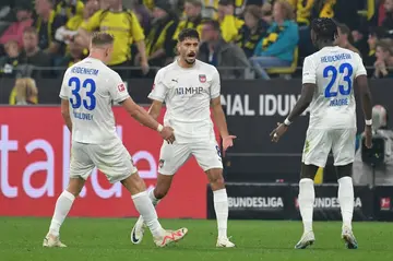 On-loan Eren Dinkci (C) scored twice for Heidenheim against his parent club Werder Bremen to give the promoted side their first ever Bundesliga win