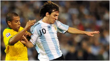 Lionel Messi vies for the ball with Felipe Melo during their 2010 FIFA World Cup qualifier at the Gigante de Arroyito stadium. Photo by Richard Rad.