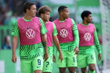 Wolfsburg's German forward Max Kruse (L) has been told his days are over at the club.