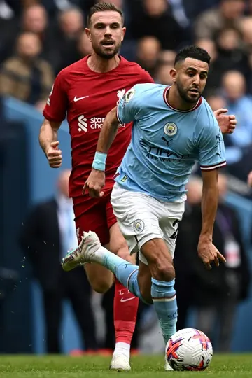 Riyad Mahrez (R), escaping Jordan Henderson, had two assists as Manchester City fought back to beat Liverpool