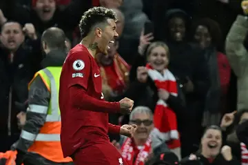 Rout: Roberto Firmino scores the final goal of Liverpool's 7-0 thrashing of Manchester United