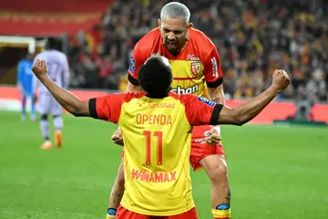 Lois Openda celebrates with Facundo Medina after scoring one of his two goals as Lens beat Monaco 3-0