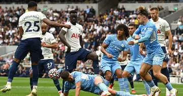 Ruben Dias of Manchester City wins a header during the Premier League match between Tottenham Hotspur and Manchester City at Tottenham Hotspur Stadium on August 15, 2021 in London, England. (Photo by Shaun Botterill/Getty Images)