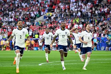 England players celebrate after beating Switzerland on penalties in Saturday's quarter-final