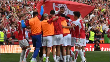 Arsenal players celebrate during the Premier League match between Arsenal FC and Manchester United at Emirates Stadium. Photo by Stuart MacFarlane.