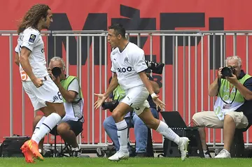 Alexis Sanchez (R) celebrates with Matteo Guendouzi after scoring for Marseille against Nice