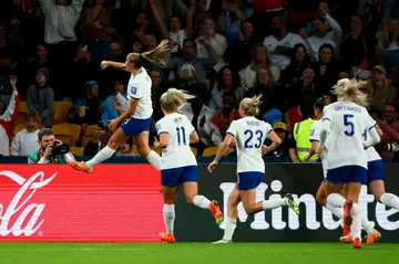 England midfielder  Georgia Stanway celebrates scoring her penalty