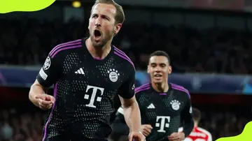 Harry Kane celebrates scoring against Arsenal FC