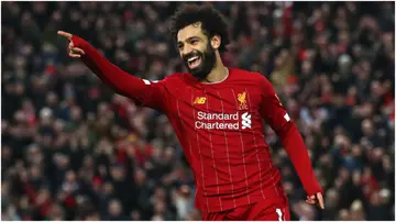 Mohamed Salah celebrates after scoring during the Premier League match between Liverpool FC and Southampton FC at Anfield. Photo by Julian Finney.