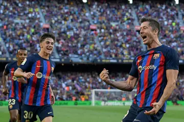 Robert Lewandowski (R) has scored four times in his past two games for Barcelona