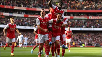 Arsenal stars celebrate after scoring during the Premier League match between Arsenal FC and Liverpool FC at Emirates Stadium. Photo by Justin Setterfield.