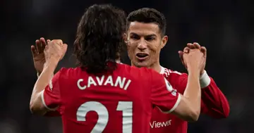 Edinson Cavani celebrates scoring Manchester United's second goal with Cristiano Ronaldo during the Premier League match against Tottenham Hotspur. (Photo by Visionhaus/Getty Images)