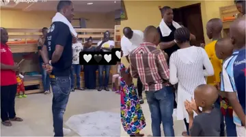 Amazing Moment As Former Super Eagle Striker Odion Ighalo Spotted Praying With Children at His Orphanage Home