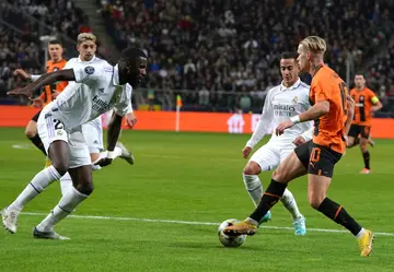 Real Madrid's German defender Antonio Rudiger (L) tries to win the ball against Shakhtar Donetsk