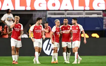 Arsenal's players celebrate after Leandro Trossard (third left) scores in the English team's 5-3 win over Barcelona