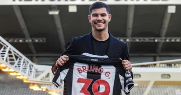 Bruno Guimares poses with a Newcastle shirt after his move. Photo: Twitter/@TANG_Foot.