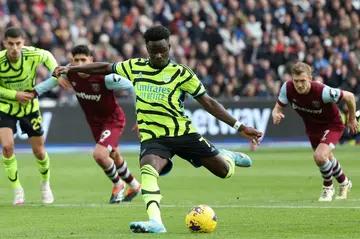 Arsenal's Bukayo Saka scores his team's second goal from the penalty spot at Burnley
