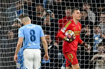 Andriy Lunin (right) was Real Madrid's unlikely hero with two penalty saves against Manchester City
