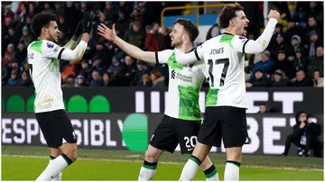 Diogo Jota celebrates with Luis Diaz and Curtis Jones after scoring during their Premier League match at Turf Moor. Photo by Nick Potts.