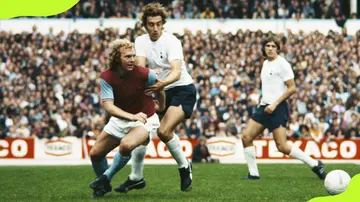 West Ham's Bobby Moore controls the ball Tottenham Hotspurs' Martin Chivers