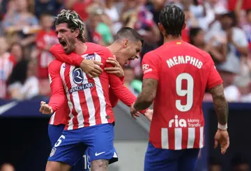 Atletico Madrid midfielder Rodrigo De Paul (L) celebrates his fine strike to earn his team victory against Celta Vigo