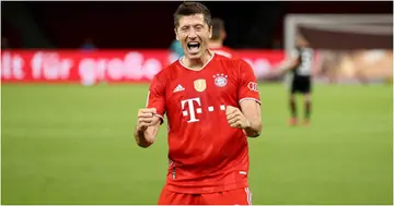 Robert Lewandowski celebrates scoring during the DFB Cup final match between Leverkusen and Bayern Muenchen in Berlin, Germany. Photo by Alexander Hassenstein/Getty Images.