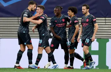 Manchester City players celebrate after Julian Alvarez (2nd L) scored against RB Leipzig