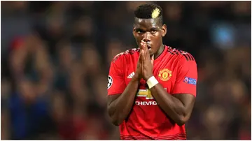 Paul Pogba looks dejected after hitting the post during a Champions League between Manchester United and Juventus at Old Trafford in 2018. Photo by Michael Regan.